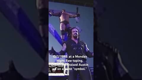 12/1/1998: at a Monday Night Raw taping, Undertaker raised Austin up on a giant “symbol.”