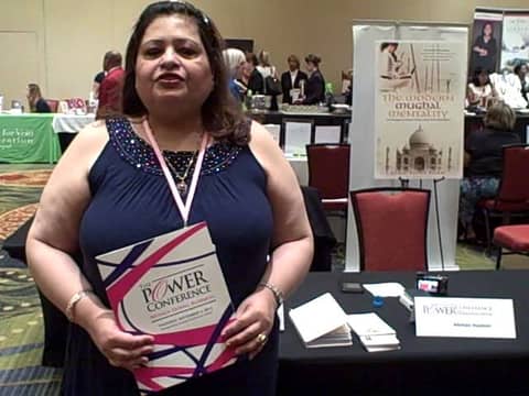 Dr.Afshan Hashmi signing her book at the Power Conference Women Doing Business