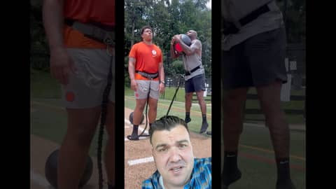 Brandon Jacobs looks small standing next to his son Braydon Jacobs.