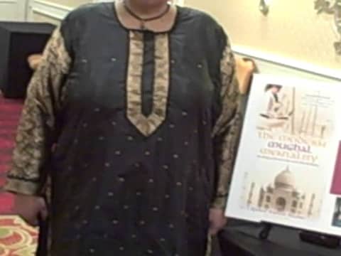 Dr Afshan Hashmi signing her book in a Women Empowerment Conference