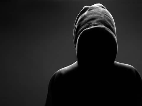 Hooded Figure Standing Over Me